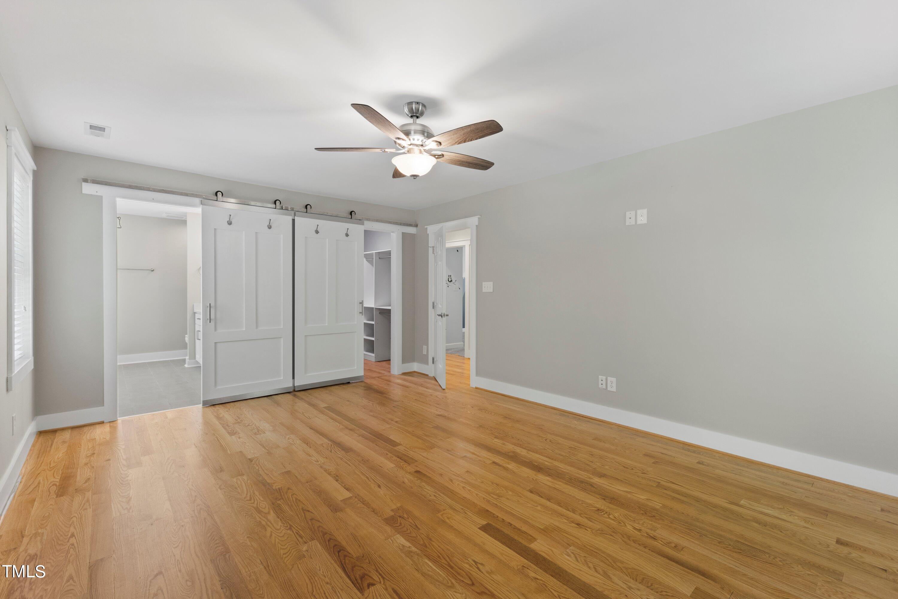7408 Lakefall Drive Wake Forest, NC 27587 - Photo 28 of 65 a view of an empty room with wooden floor