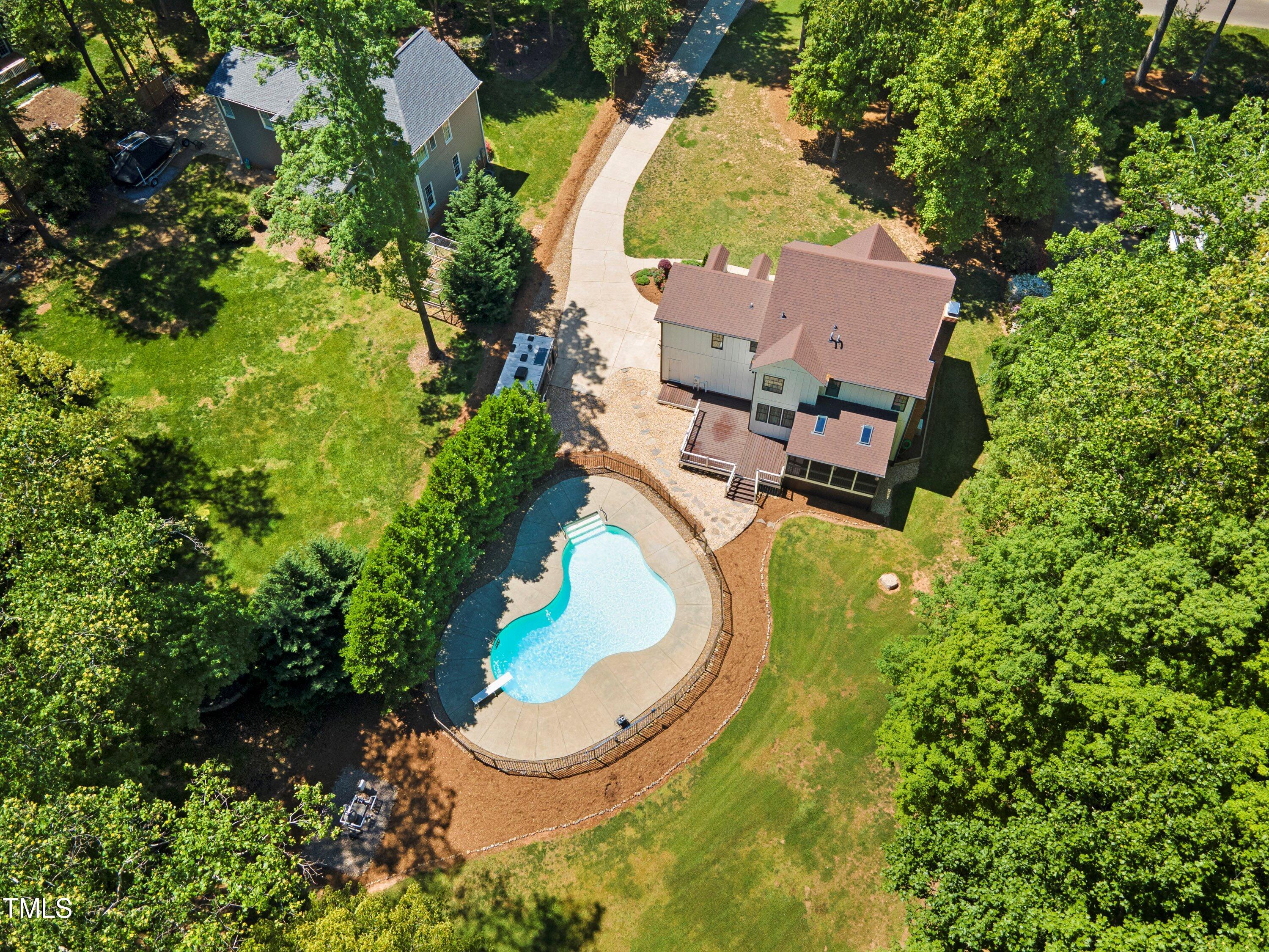 7408 Lakefall Drive Wake Forest, NC 27587 - Photo 3 of 65 an aerial view of a house with a swimming pool