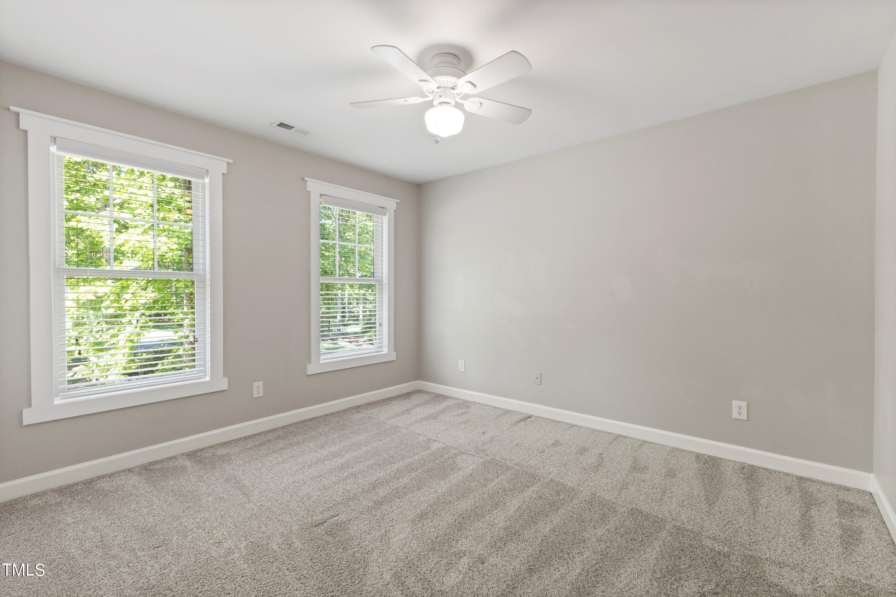 7408 Lakefall Drive Wake Forest, NC 27587 - Photo 35 of 65 a view of an empty room with a window