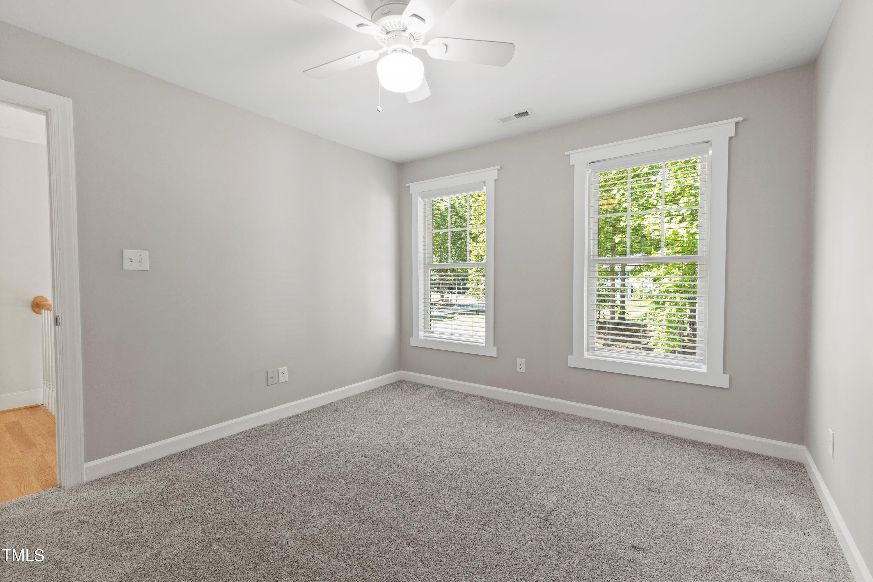 7408 Lakefall Drive Wake Forest, NC 27587 - Photo 36 of 65 a view of an empty room with a window