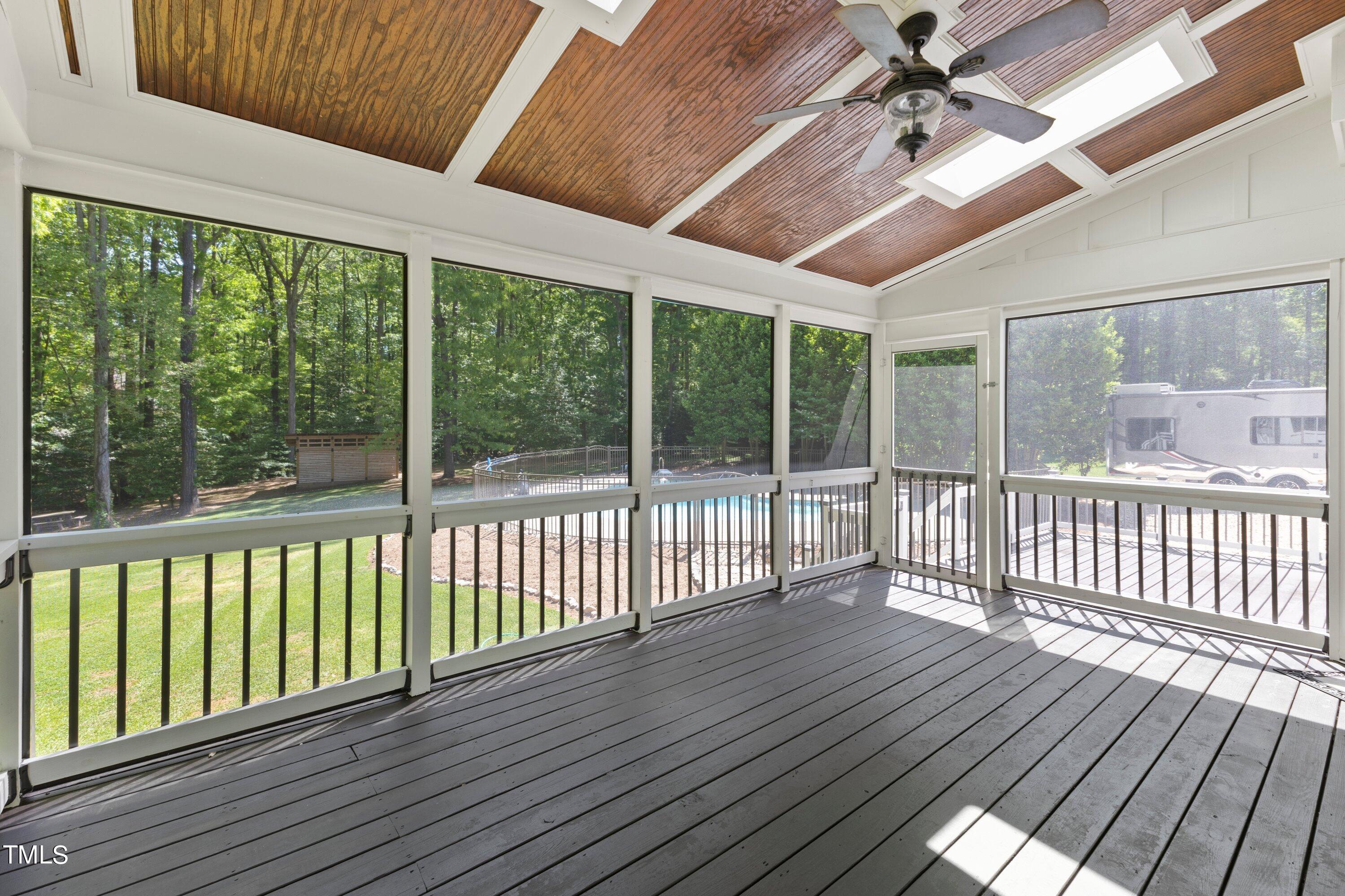 7408 Lakefall Drive Wake Forest, NC 27587 - Photo 47 of 65 a view of a porch with wooden floor