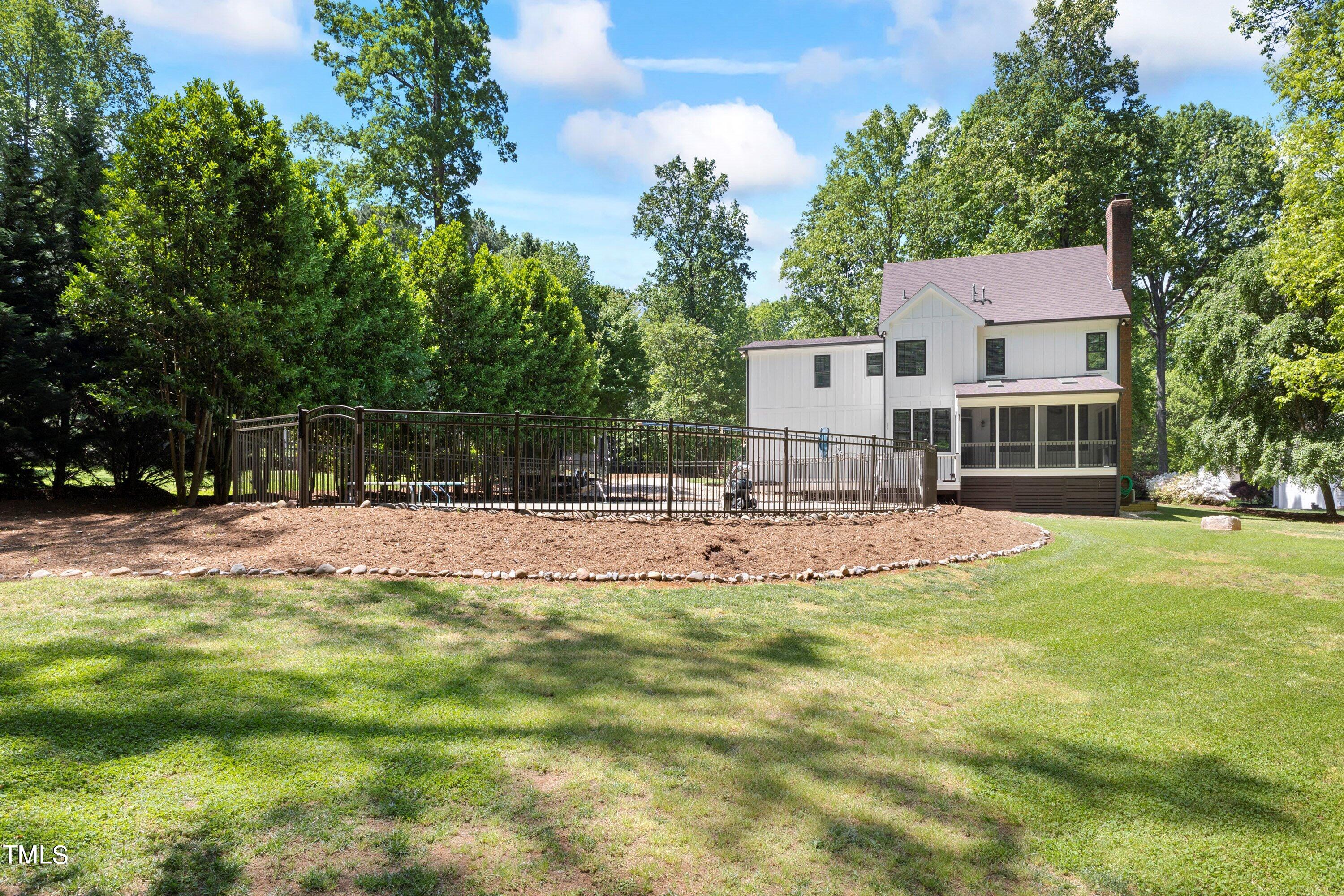 7408 Lakefall Drive Wake Forest, NC 27587 - Photo 52 of 65 a view of a house with a yard
