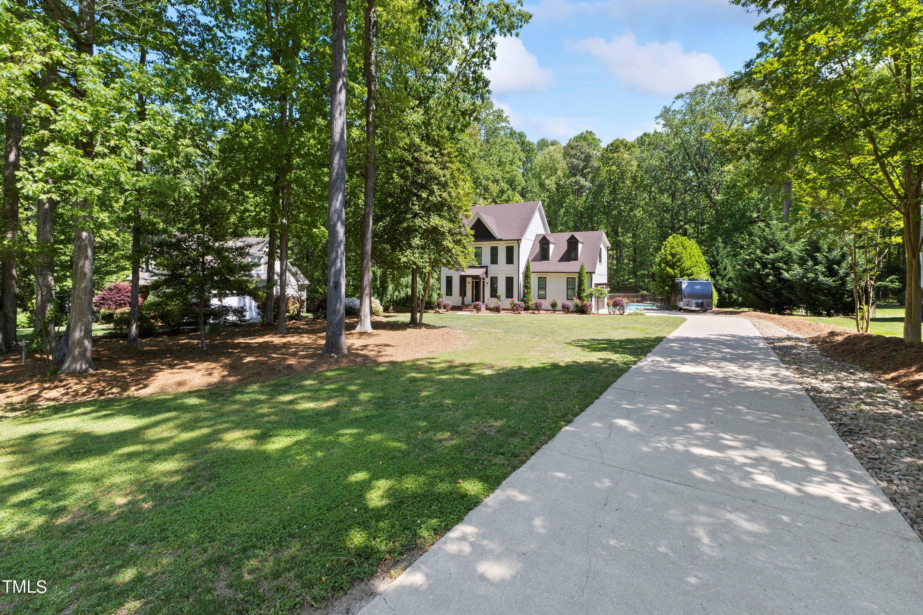 7408 Lakefall Drive Wake Forest, NC 27587 - Photo 60 of 65 a front view of a house with a yard