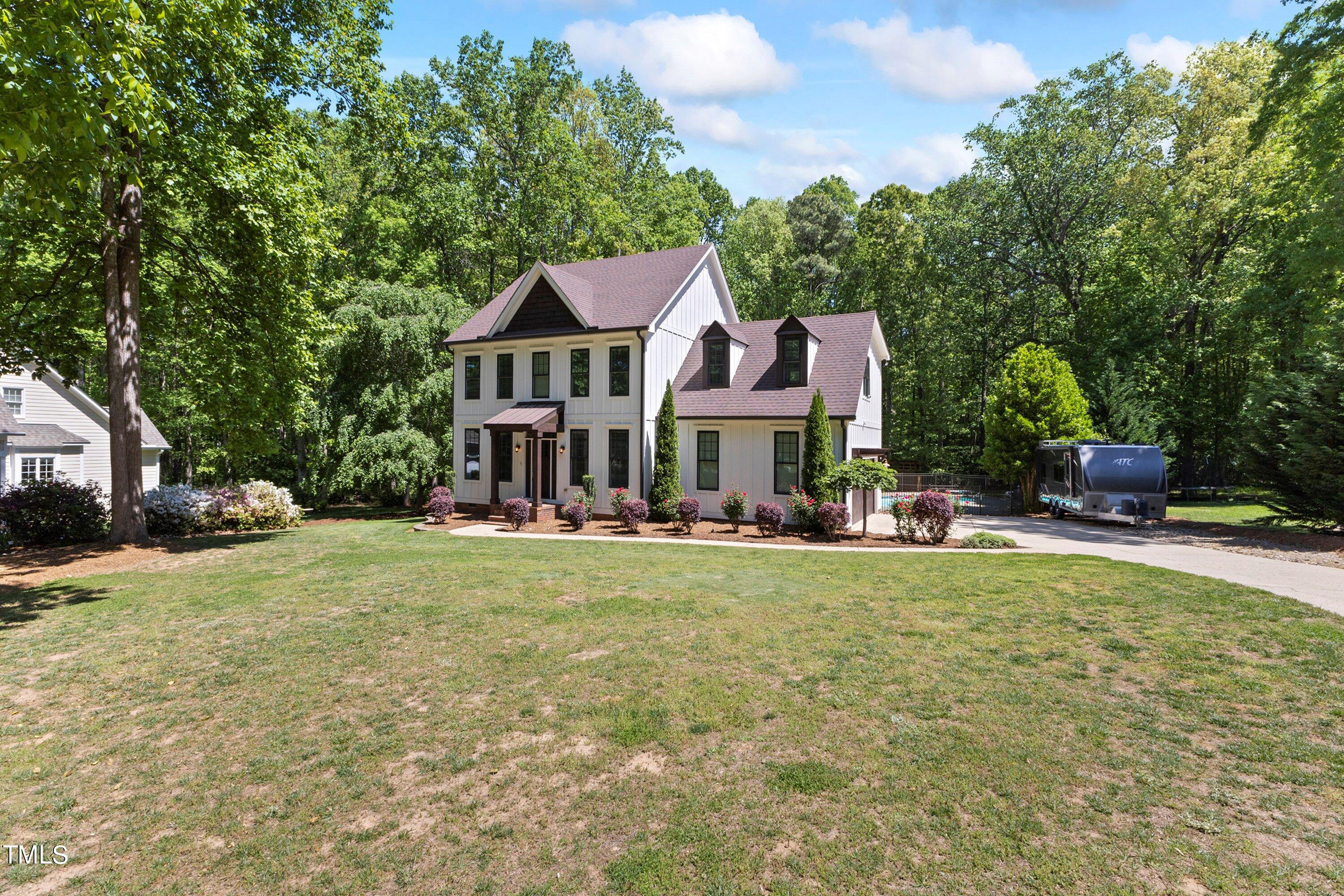 7408 Lakefall Drive Wake Forest, NC 27587 - Photo 61 of 65 a view of a house with a big yard plants and large trees