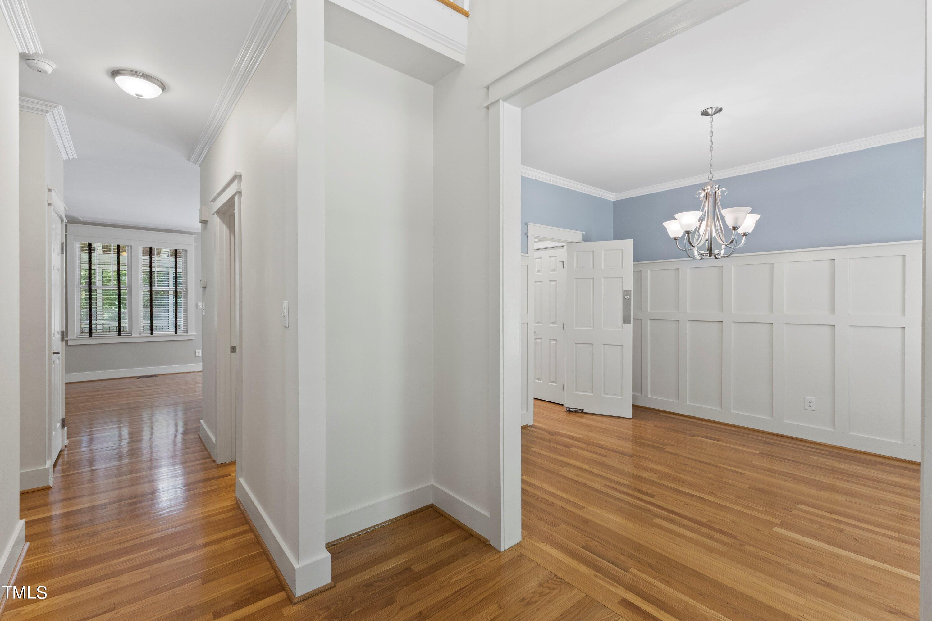 7408 Lakefall Drive Wake Forest, NC 27587 - Photo 9 of 65 a view of a room with wooden floor chandelier and closet
