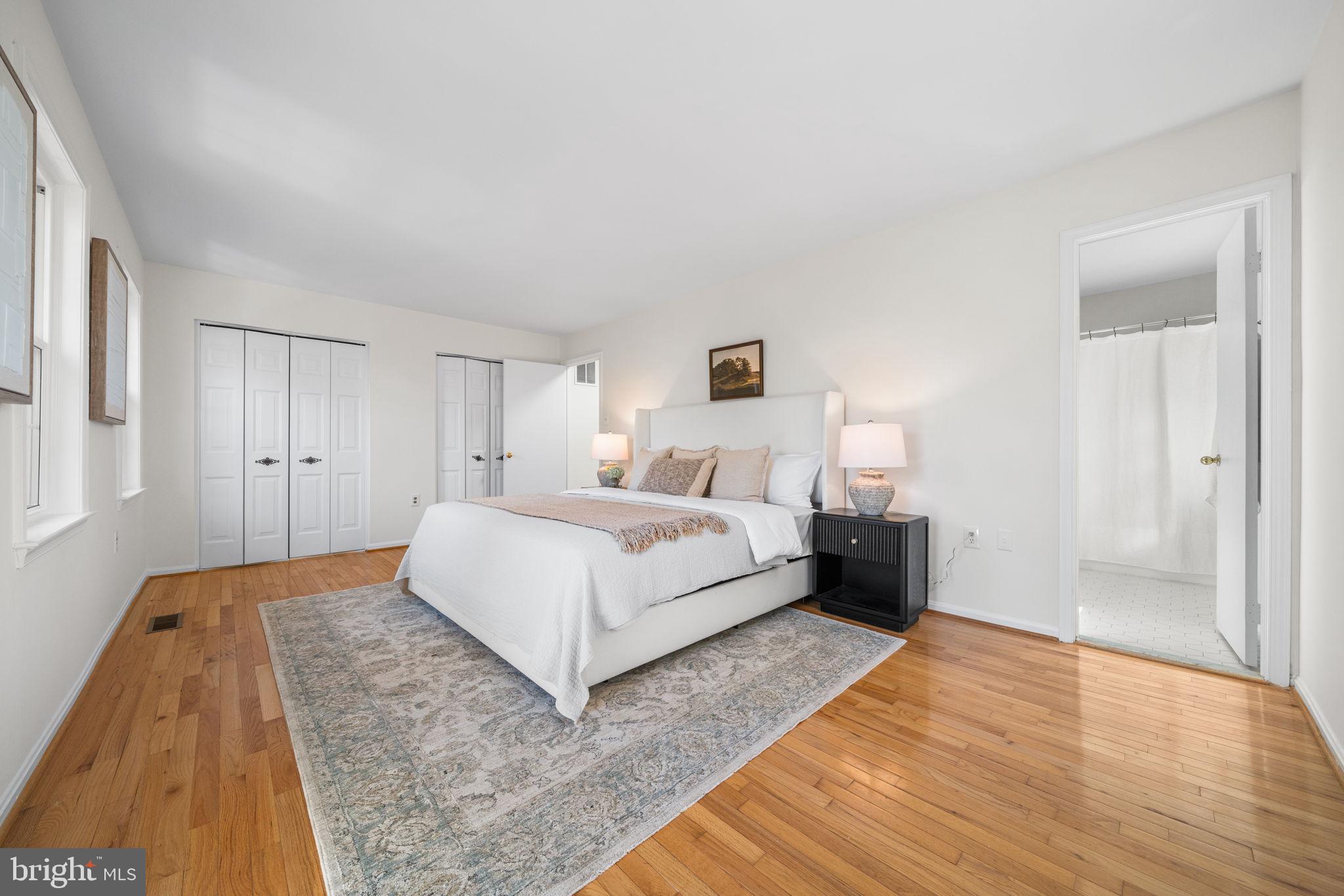 5658 Sutherland Court Burke, VA 22015 - Photo 14 of 30 a bedroom with a bed and a night stand