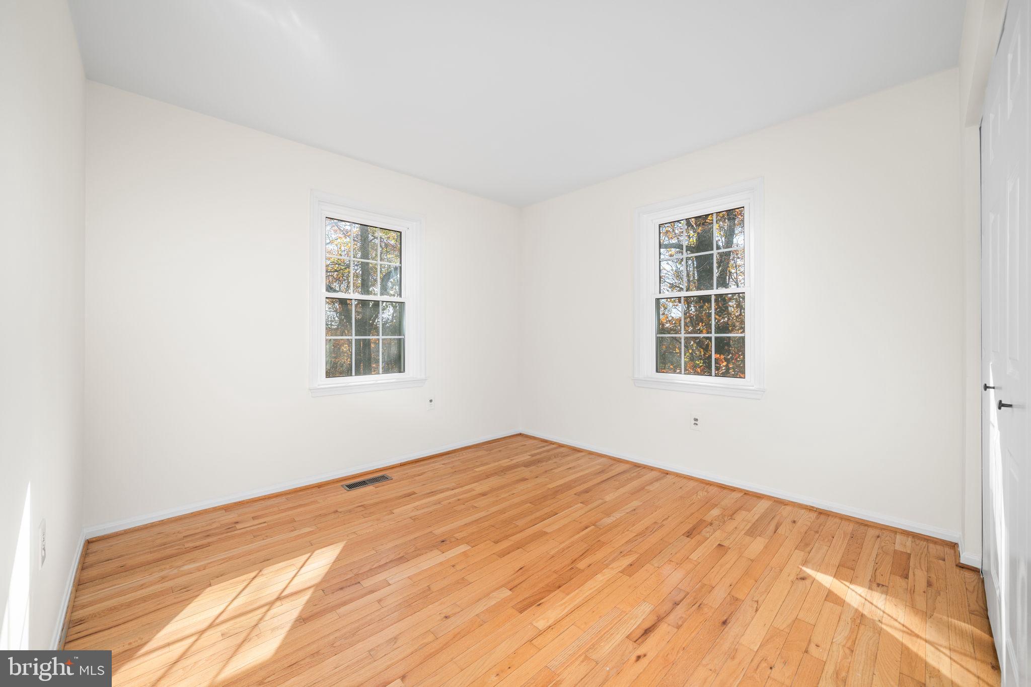 5658 Sutherland Court Burke, VA 22015 - Photo 18 of 30 a view of empty room with windows
