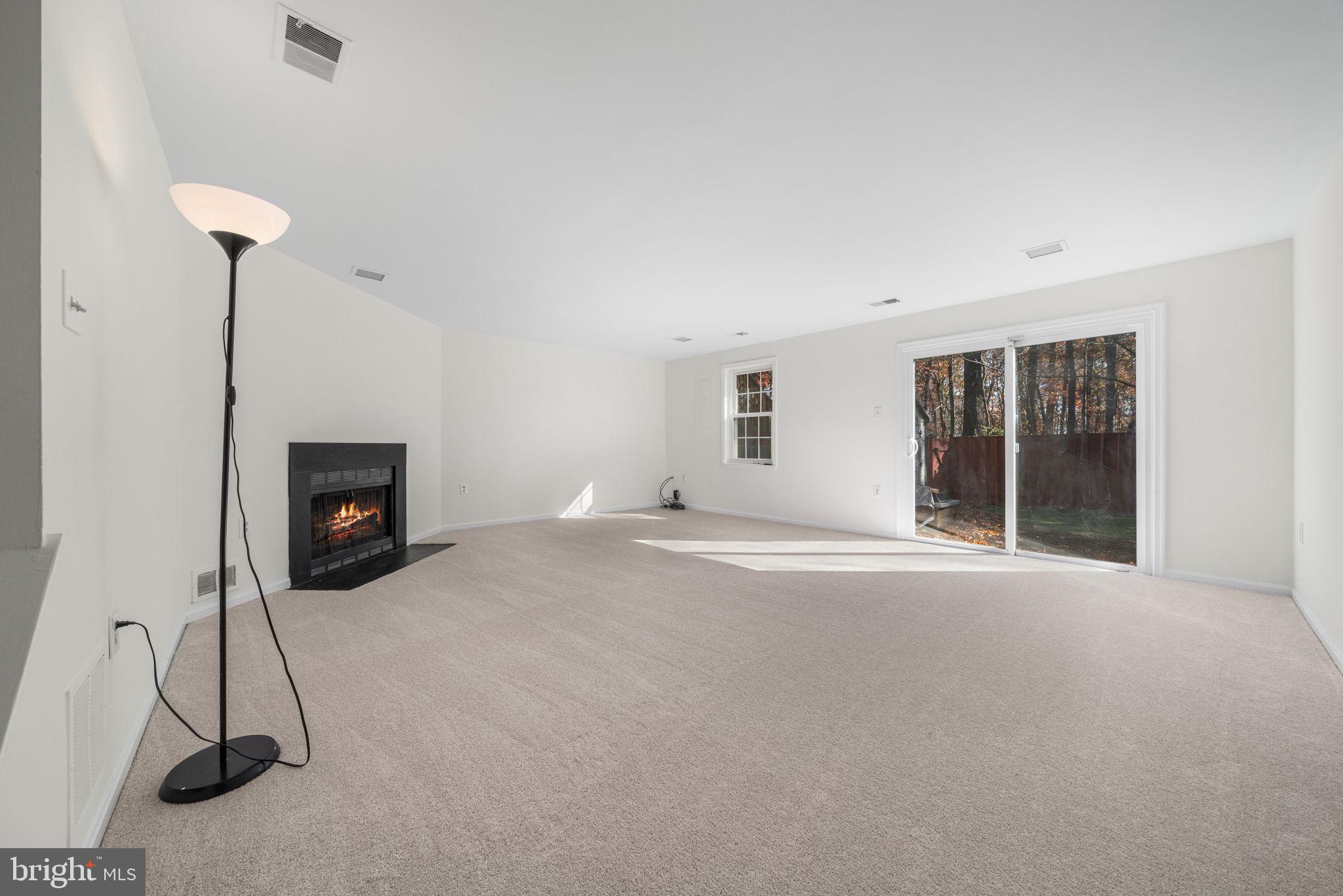 5658 Sutherland Court Burke, VA 22015 - Photo 19 of 30 a view of an empty room with a fireplace