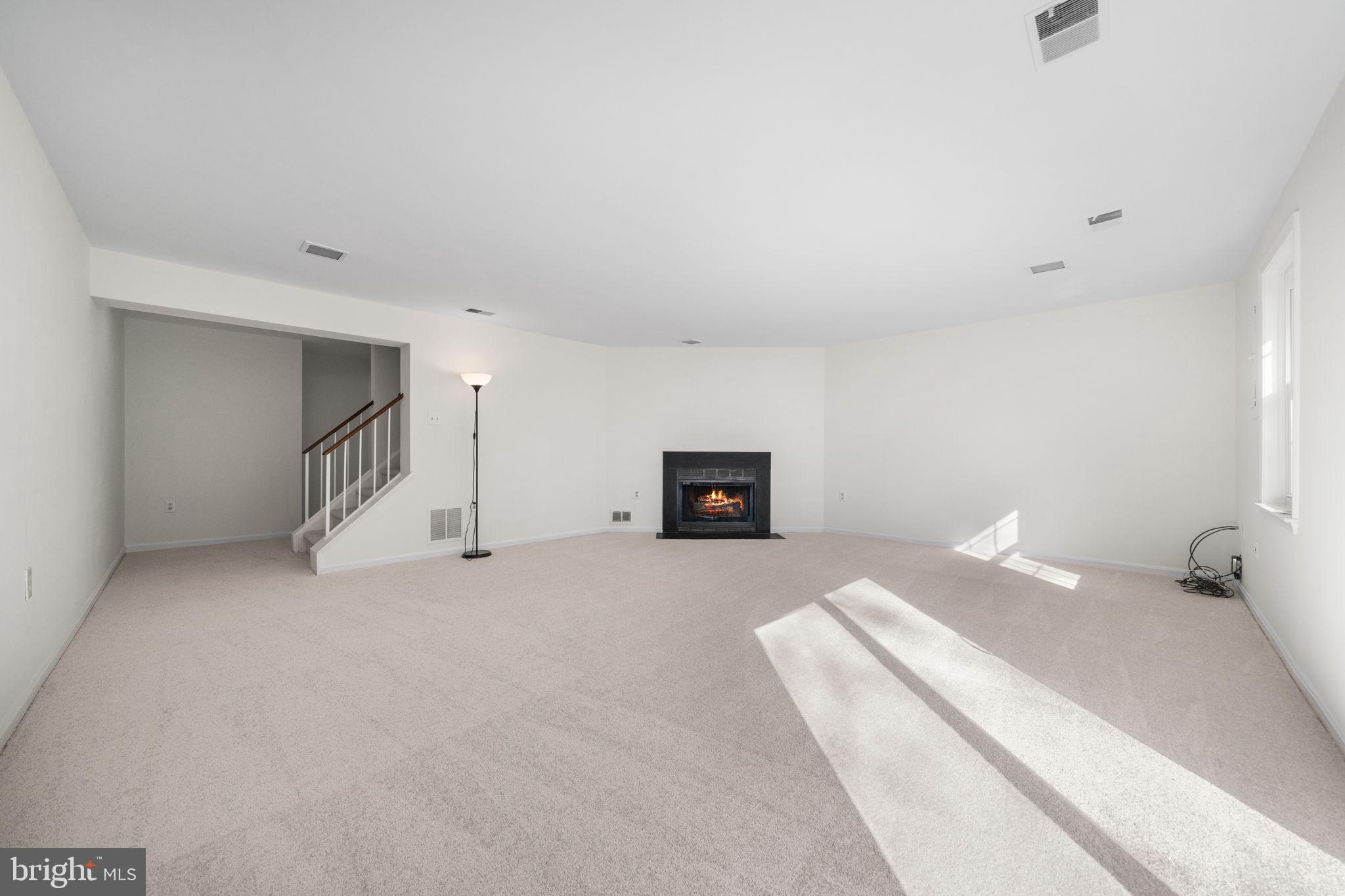 5658 Sutherland Court Burke, VA 22015 - Photo 20 of 30 a bedroom with a bed and a lamp