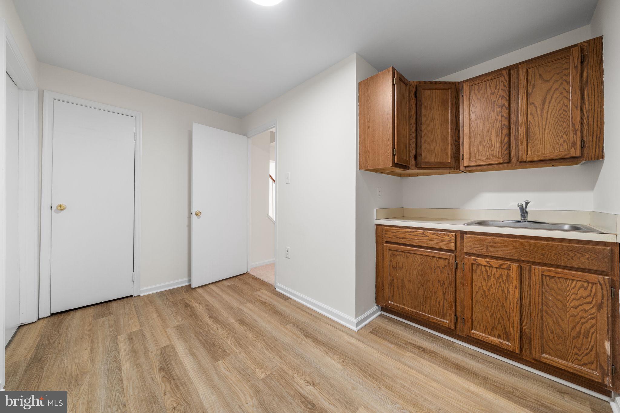 5658 Sutherland Court Burke, VA 22015 - Photo 23 of 30 a view of a kitchen with sink and cabinets