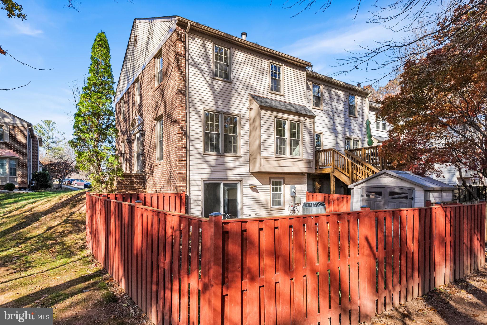 5658 Sutherland Court Burke, VA 22015 - Photo 24 of 30 a street view with tall buildings