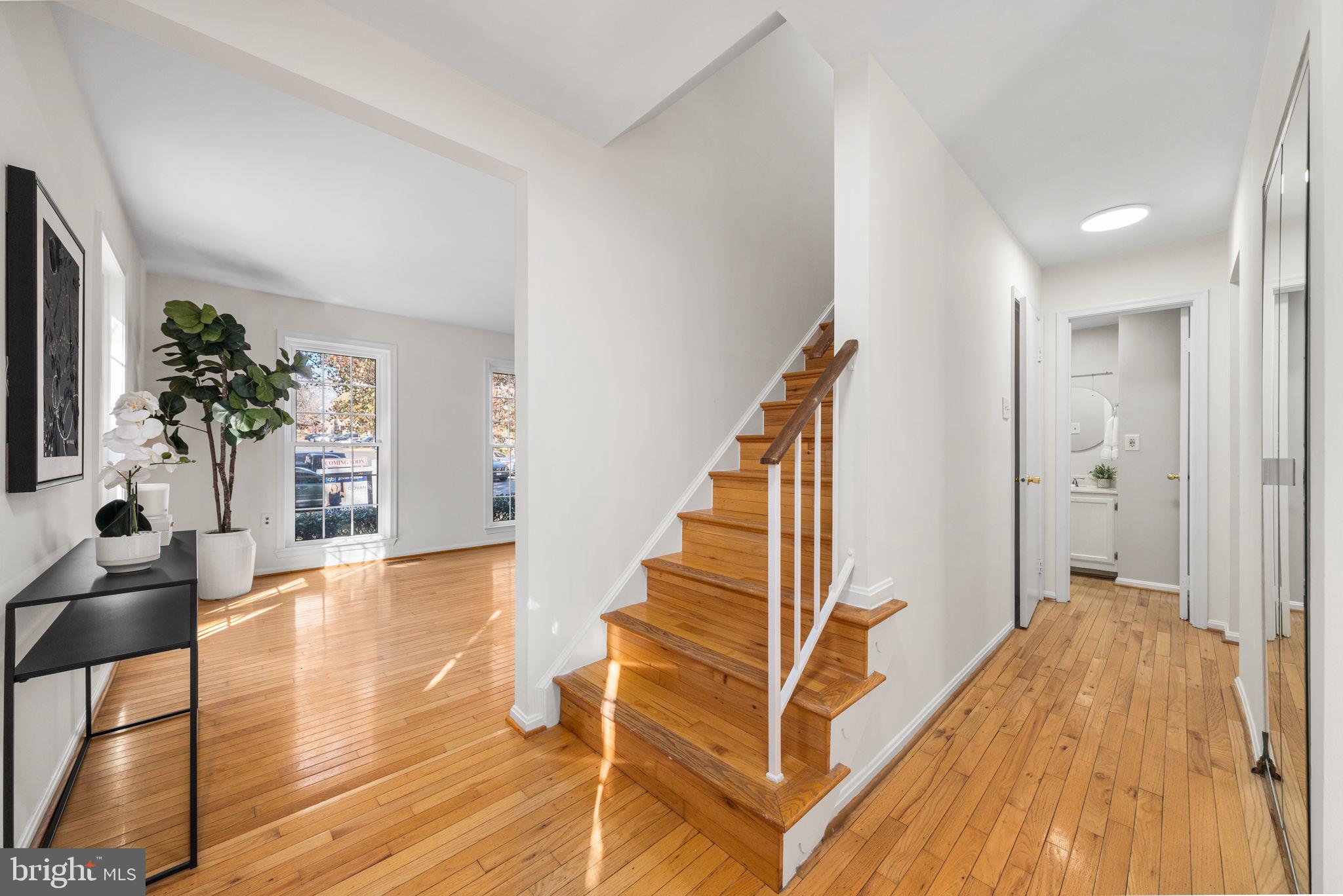 5658 Sutherland Court Burke, VA 22015 - Photo 3 of 30 a view of entryway with wooden floor and stairs