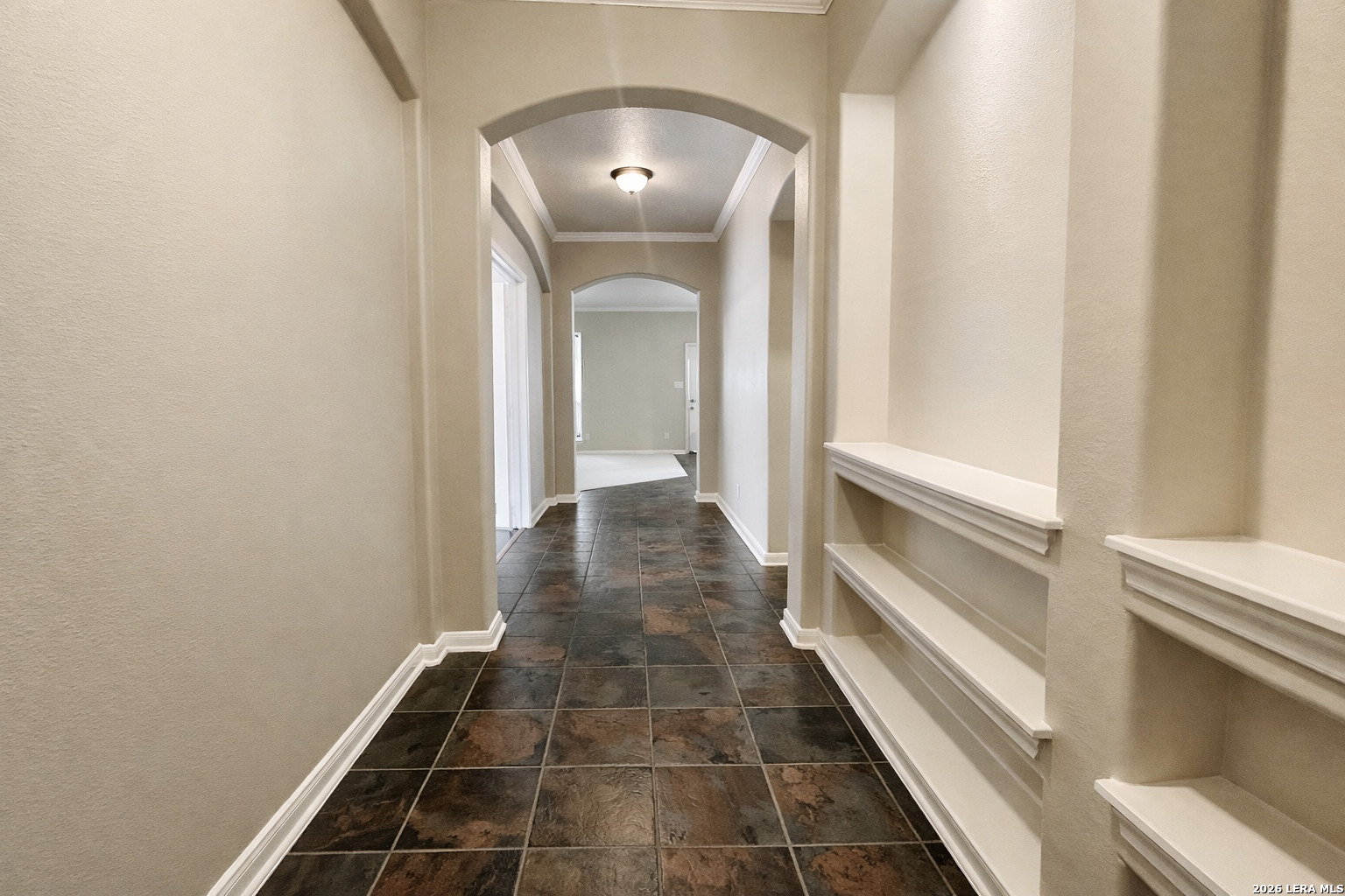 15603 Luna Ridge Helotes, TX 78023 - Photo 14 of 24 a view of a hallway with wooden floor and staircase