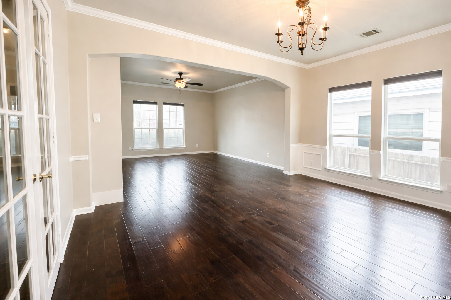 15603 Luna Ridge Helotes, TX 78023 - Photo 15 of 24 a view of an empty room with wooden floor and a window