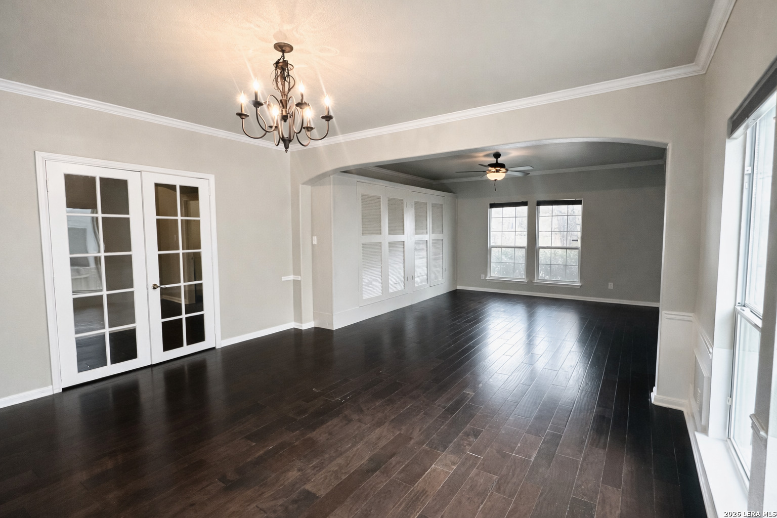 15603 Luna Ridge Helotes, TX 78023 - Photo 16 of 24 a view of an empty room with wooden floor and a window