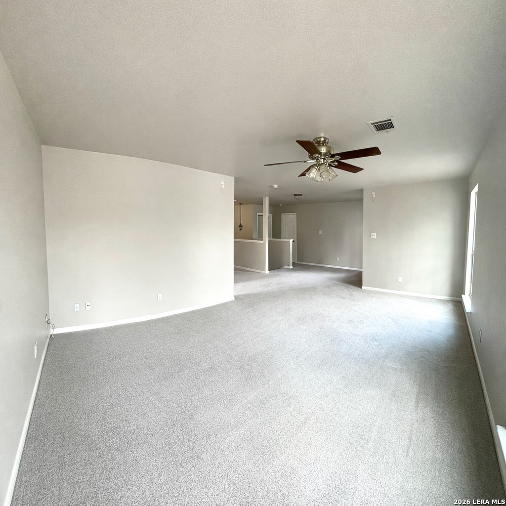 15603 Luna Ridge Helotes, TX 78023 - Photo 20 of 24 a view of a livingroom with a ceiling fan and window