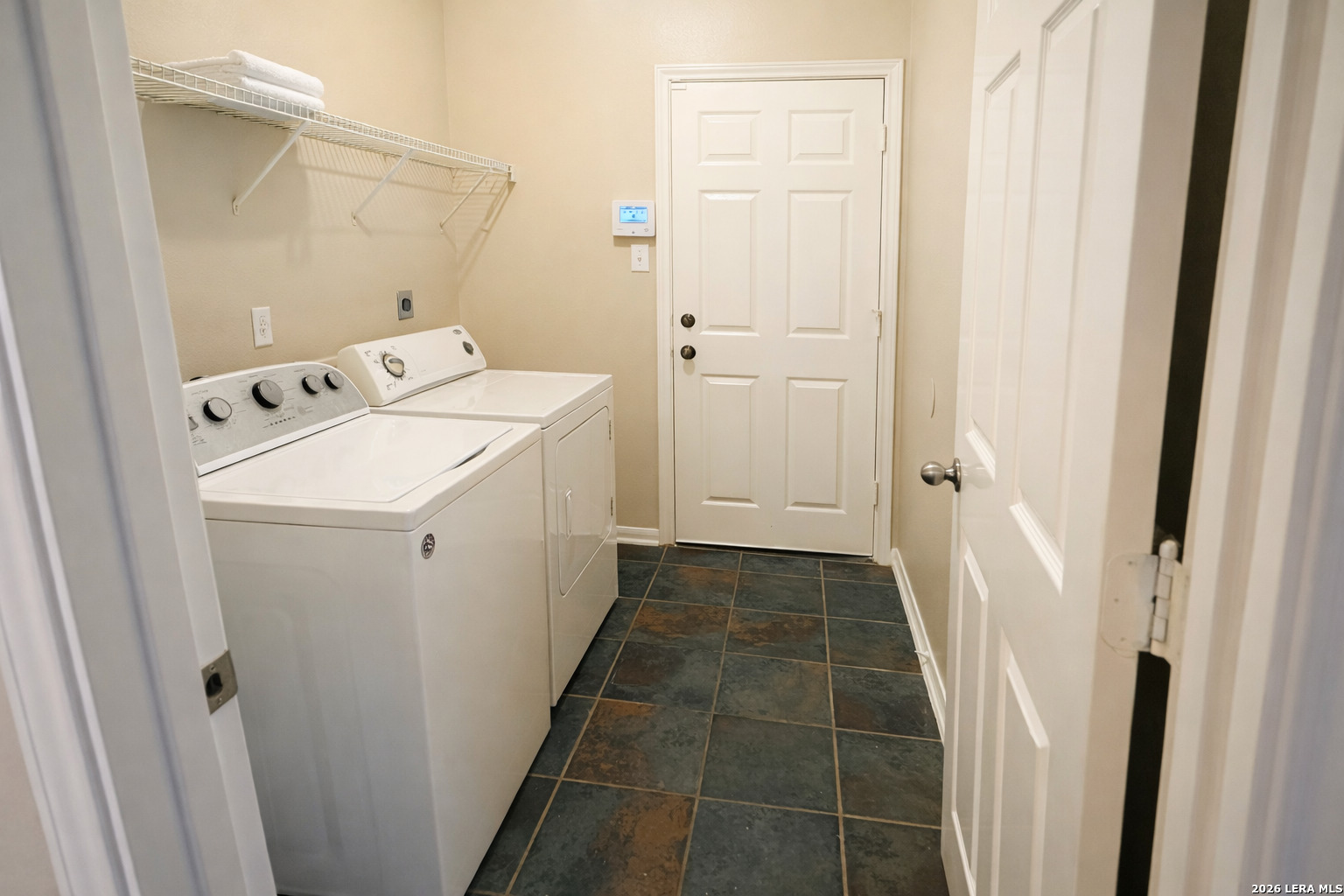 15603 Luna Ridge Helotes, TX 78023 - Photo 24 of 24 a utility room with dryer and washer