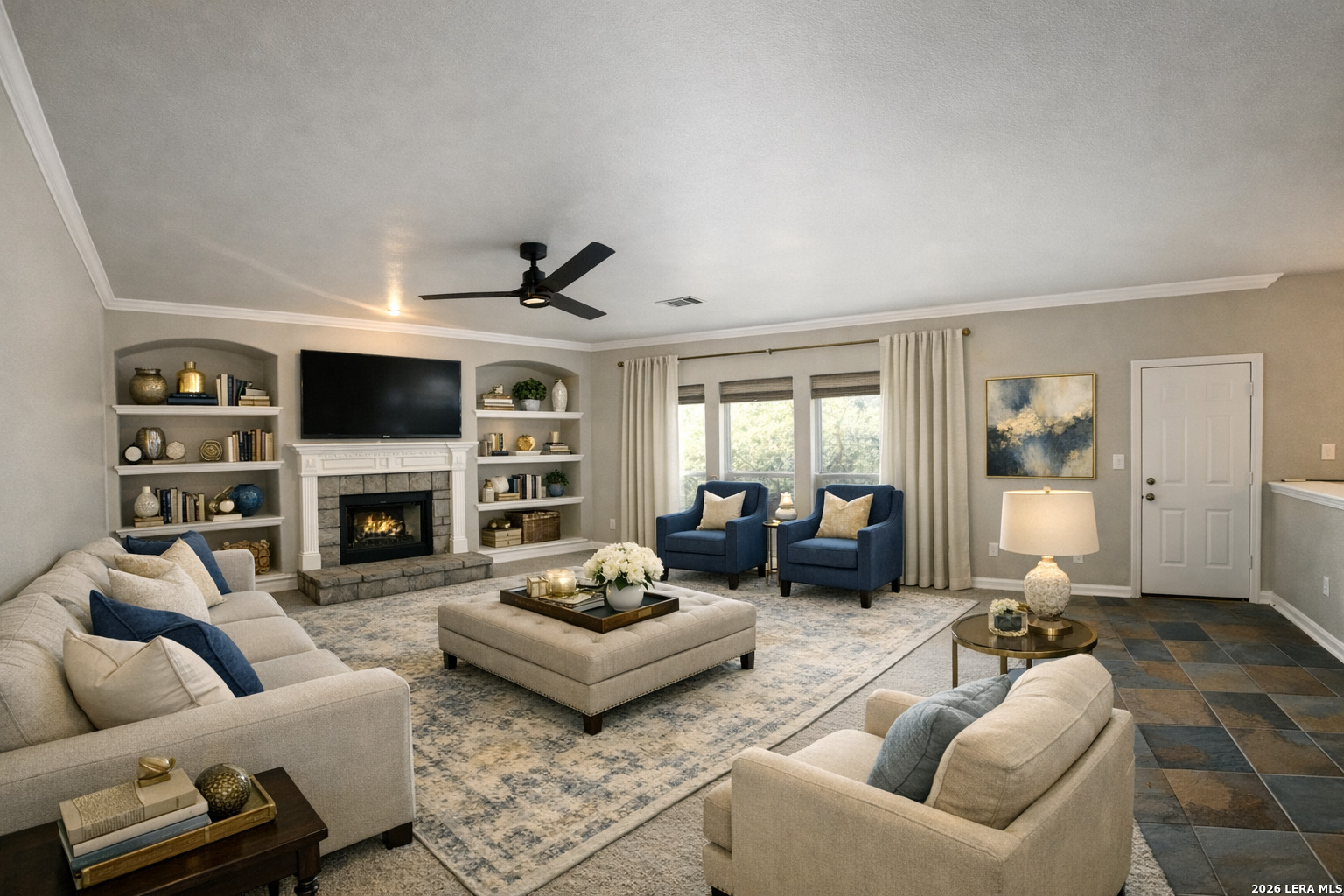 15603 Luna Ridge Helotes, TX 78023 - Photo 4 of 24 a living room with furniture a fireplace and a flat screen tv