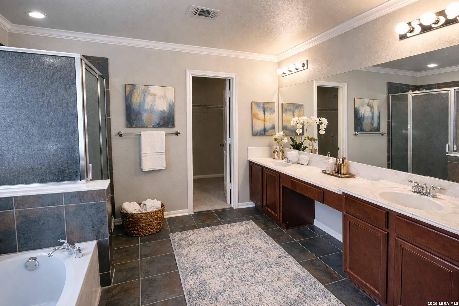 15603 Luna Ridge Helotes, TX 78023 - Photo 8 of 24 a spacious bathroom with a tub sink and mirror