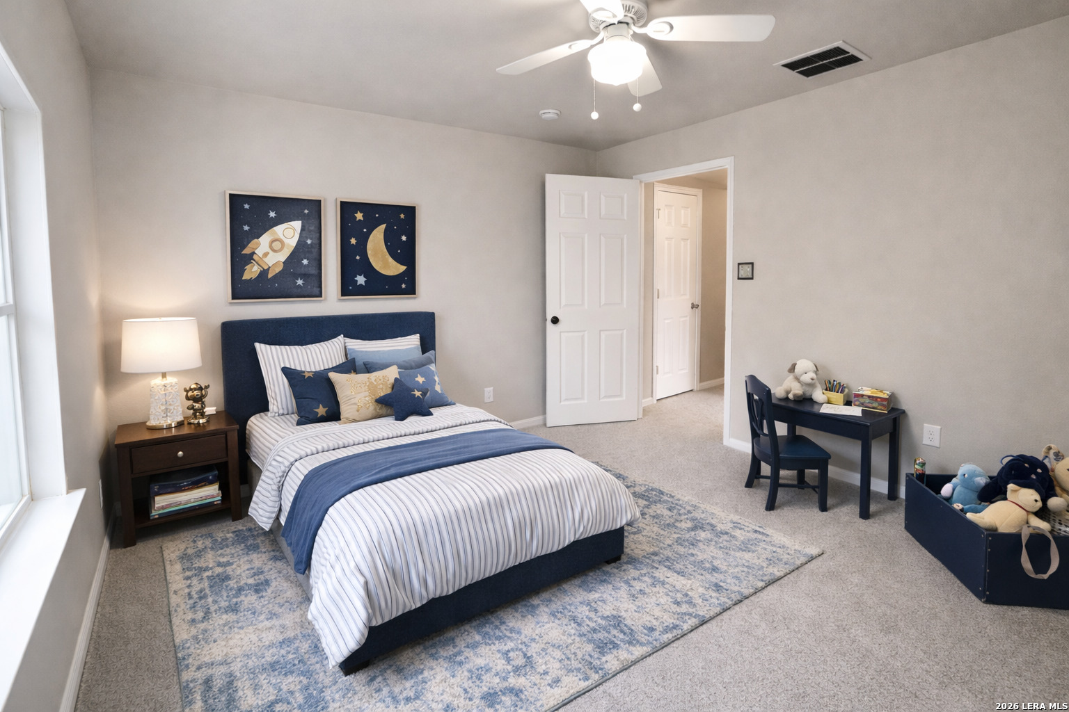 15603 Luna Ridge Helotes, TX 78023 - Photo 10 of 24 a bedroom with bed and a chandelier