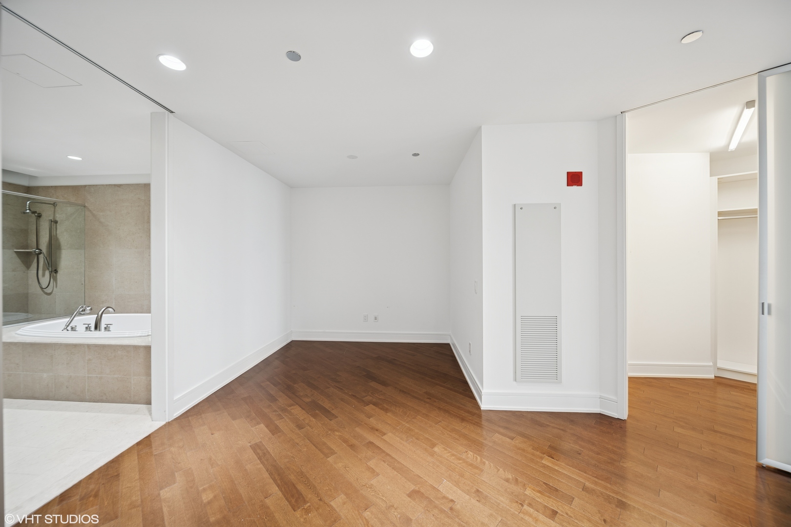 401 North Wabash Avenue, Unit 76G Chicago, IL 60611 - Photo 3 of 15 a view of a livingroom with wooden floor and a bathroom space