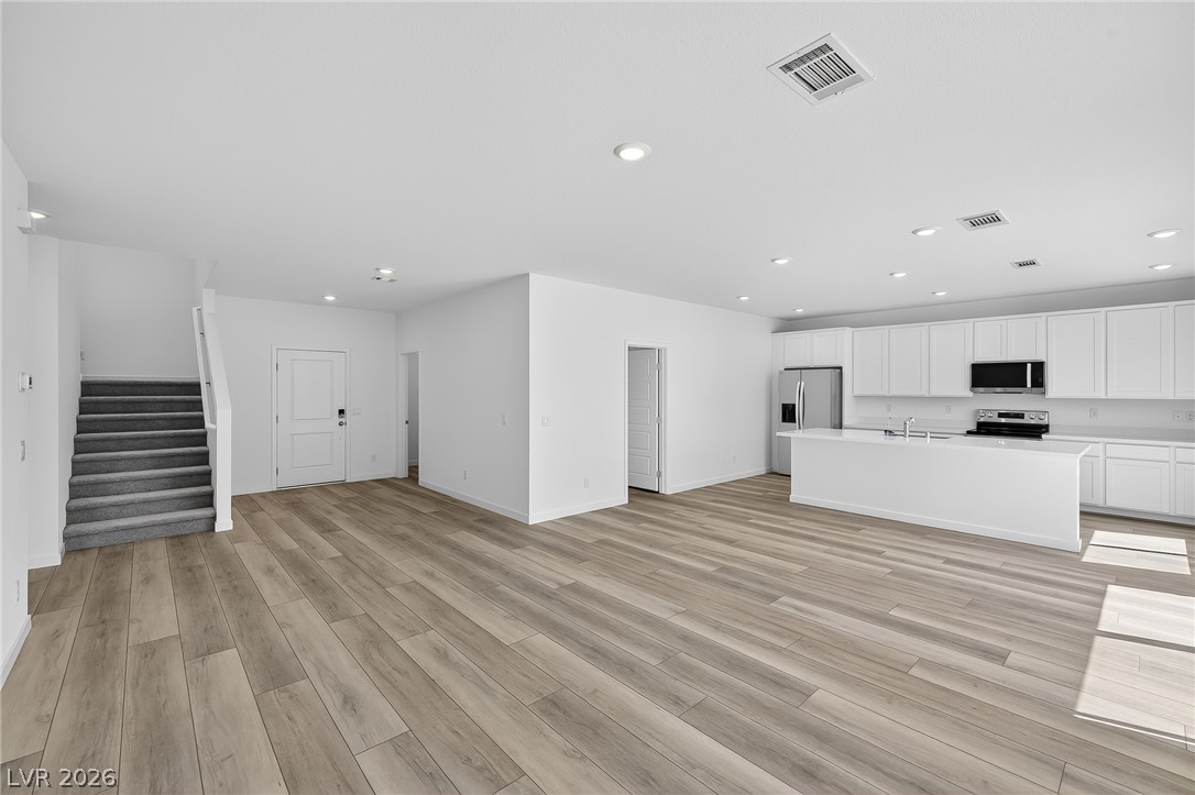 347 Sam Way Mesquite, NV 89027 - Photo 10 of 32 A seamless flow of contemporary design defines this bright living area with a sleek kitchen.
