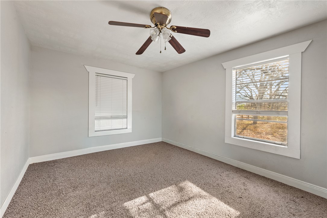 1014 Suncrest Street Bryan, TX 77803 - Photo 12 of 20 Unfurnished room featuring carpet and ceiling fan