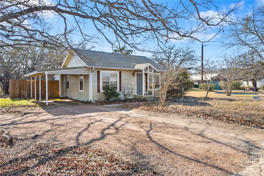 1014 Suncrest Street Bryan, TX 77803 - Photo 19 of 20 View of front of property with driveway and roof with shingles