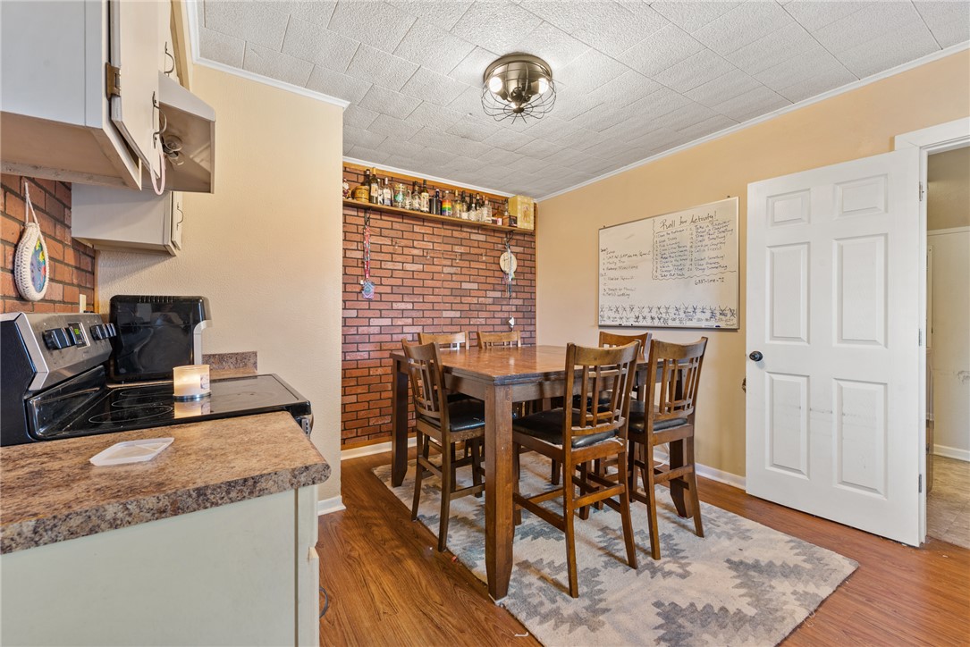 1014 Suncrest Street Bryan, TX 77803 - Photo 5 of 20 Dining area with crown molding and light wood finished floors