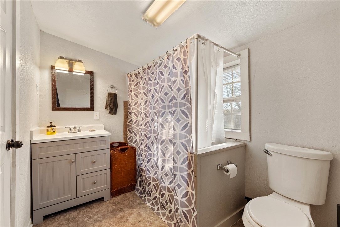 1014 Suncrest Street Bryan, TX 77803 - Photo 9 of 20 Full bathroom featuring vanity and curtained shower