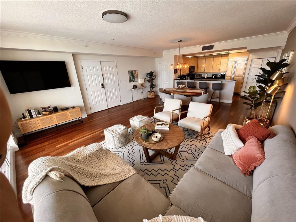 100 South Birch Road, Unit 1403F Fort Lauderdale, FL 33316 - Photo 11 of 31 a living room with furniture and a flat screen tv