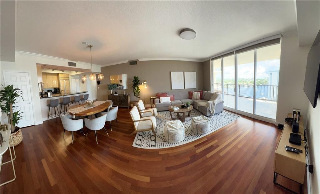 100 South Birch Road, Unit 1403F Fort Lauderdale, FL 33316 - Photo 12 of 31 a living room with furniture and a large window