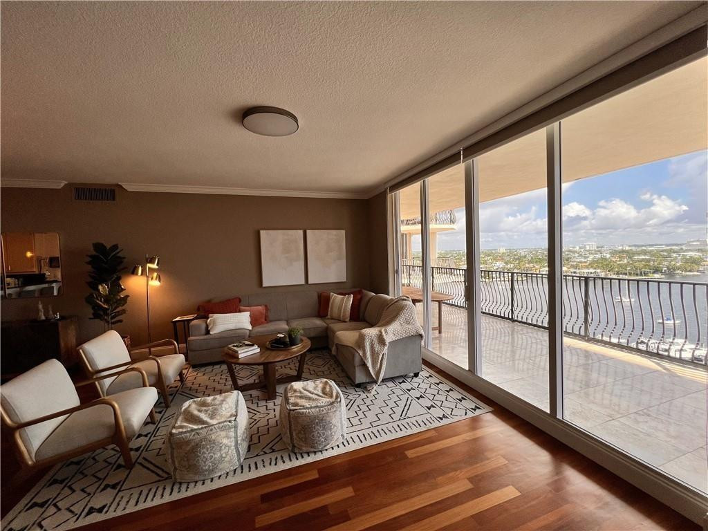 100 South Birch Road, Unit 1403F Fort Lauderdale, FL 33316 - Photo 13 of 31 a living room with furniture and a large window