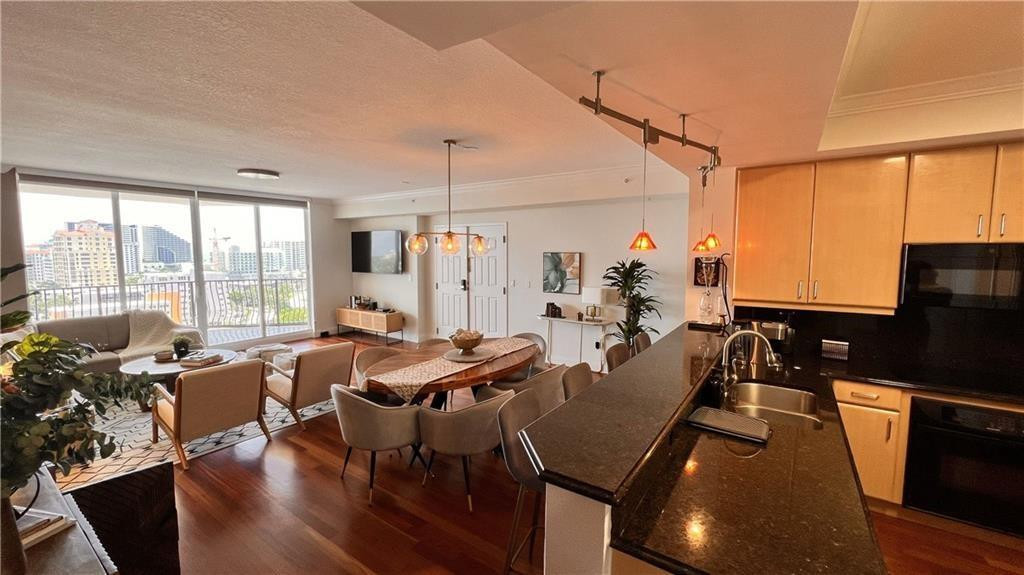100 South Birch Road, Unit 1403F Fort Lauderdale, FL 33316 - Photo 14 of 31 a very nice looking living room with a large window and dining table