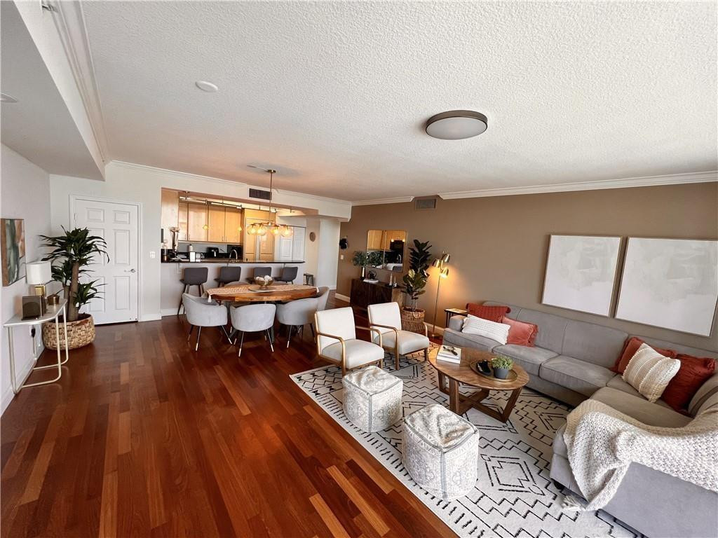 100 South Birch Road, Unit 1403F Fort Lauderdale, FL 33316 - Photo 16 of 31 a living room with furniture and wooden floor
