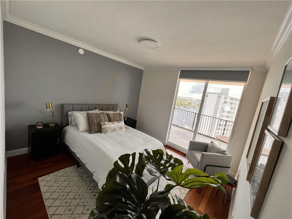 100 South Birch Road, Unit 1403F Fort Lauderdale, FL 33316 - Photo 19 of 31 a bedroom with a bed and a balcony