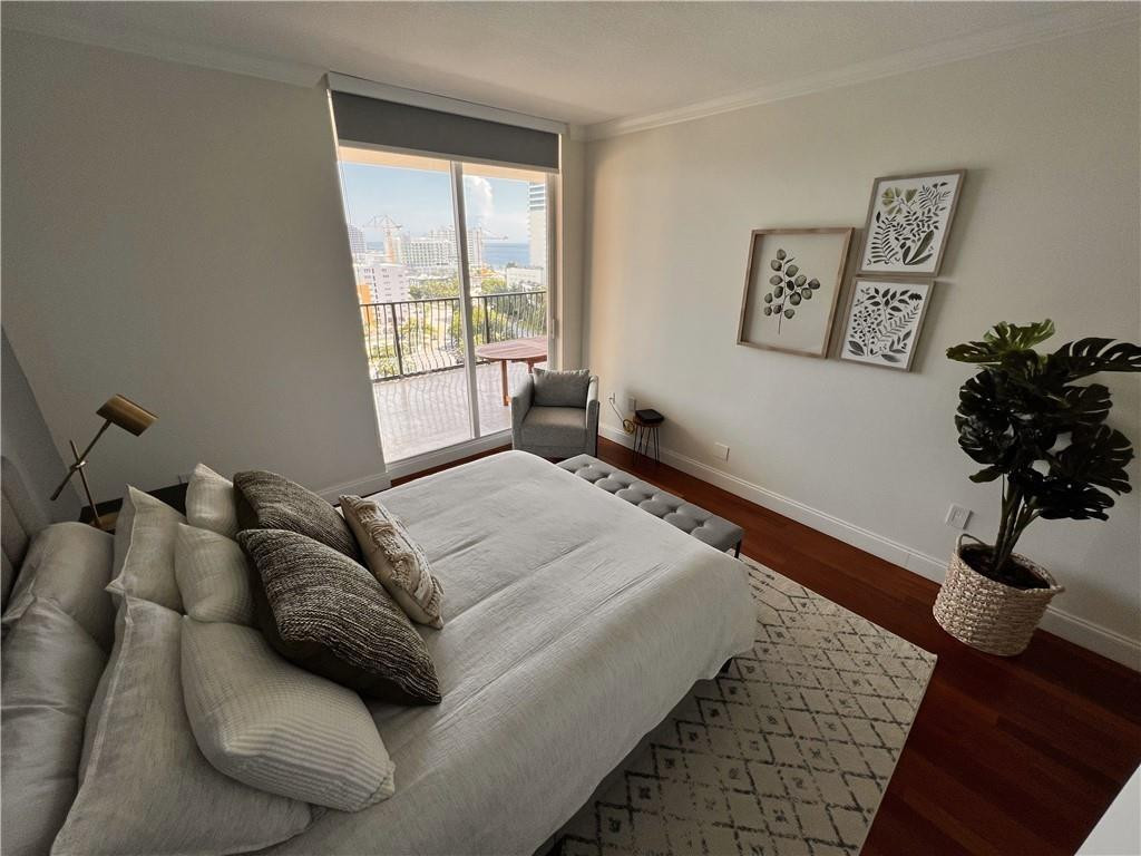 100 South Birch Road, Unit 1403F Fort Lauderdale, FL 33316 - Photo 20 of 31 a bedroom with a bed couch and window