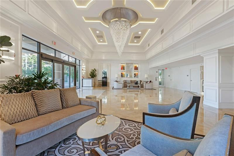 100 South Birch Road, Unit 1403F Fort Lauderdale, FL 33316 - Photo 2 of 31 a living room with furniture chandelier and a chandelier