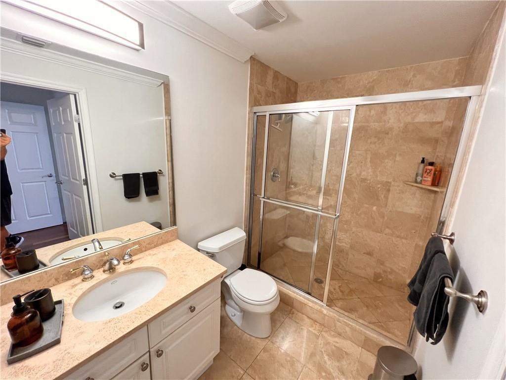 100 South Birch Road, Unit 1403F Fort Lauderdale, FL 33316 - Photo 21 of 31 a bathroom with a sink toilet and shower