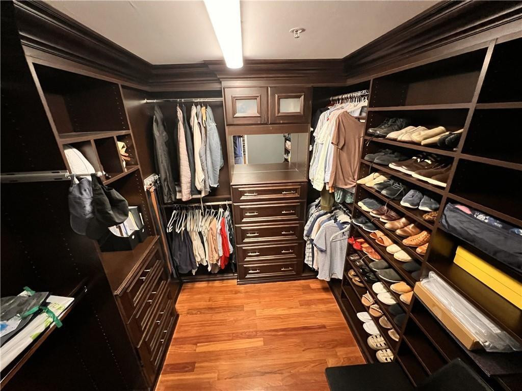 100 South Birch Road, Unit 1403F Fort Lauderdale, FL 33316 - Photo 22 of 31 a view of walk in closet with clothes and shoes