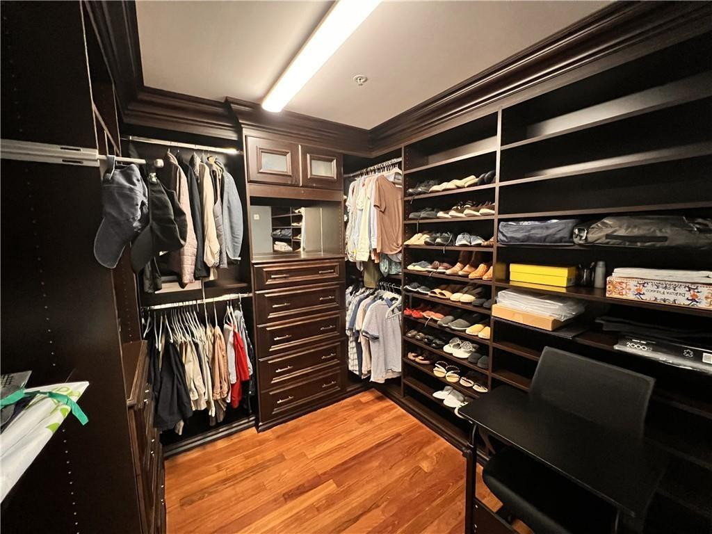 100 South Birch Road, Unit 1403F Fort Lauderdale, FL 33316 - Photo 23 of 31 a view of walk in closet with clothes and shoes
