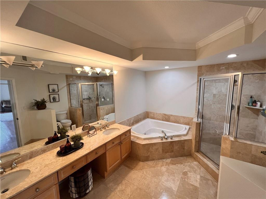 100 South Birch Road, Unit 1403F Fort Lauderdale, FL 33316 - Photo 25 of 31 a bathroom with a tub sink and shower