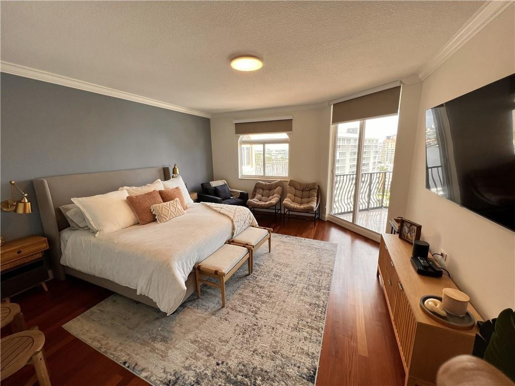 100 South Birch Road, Unit 1403F Fort Lauderdale, FL 33316 - Photo 28 of 31 a bed room with a bed and a television