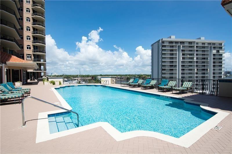100 South Birch Road, Unit 1403F Fort Lauderdale, FL 33316 - Photo 7 of 31 a view of a swimming pool with lounge chair