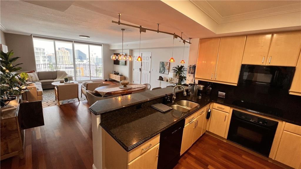 100 South Birch Road, Unit 1403F Fort Lauderdale, FL 33316 - Photo 9 of 31 a kitchen with a stove and wooden floor