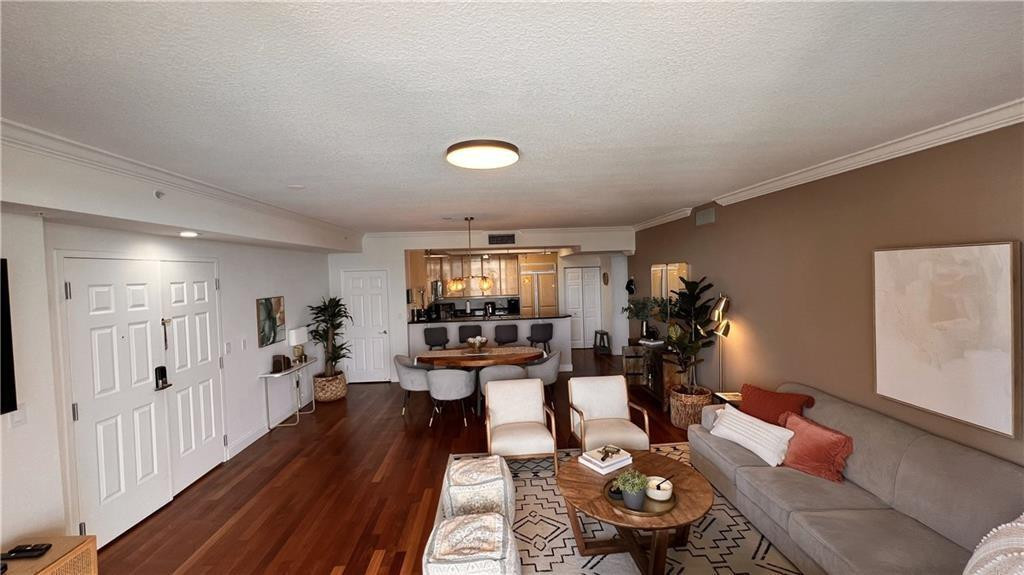 100 South Birch Road, Unit 1403F Fort Lauderdale, FL 33316 - Photo 10 of 31 a living room with furniture and a wooden floor