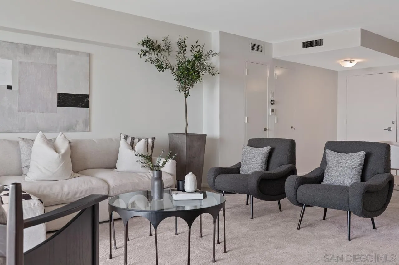 939 Coast Boulevard, Unit 20C La Jolla, CA 92037 - Photo 7 of 25 a living room with furniture and a potted plant
