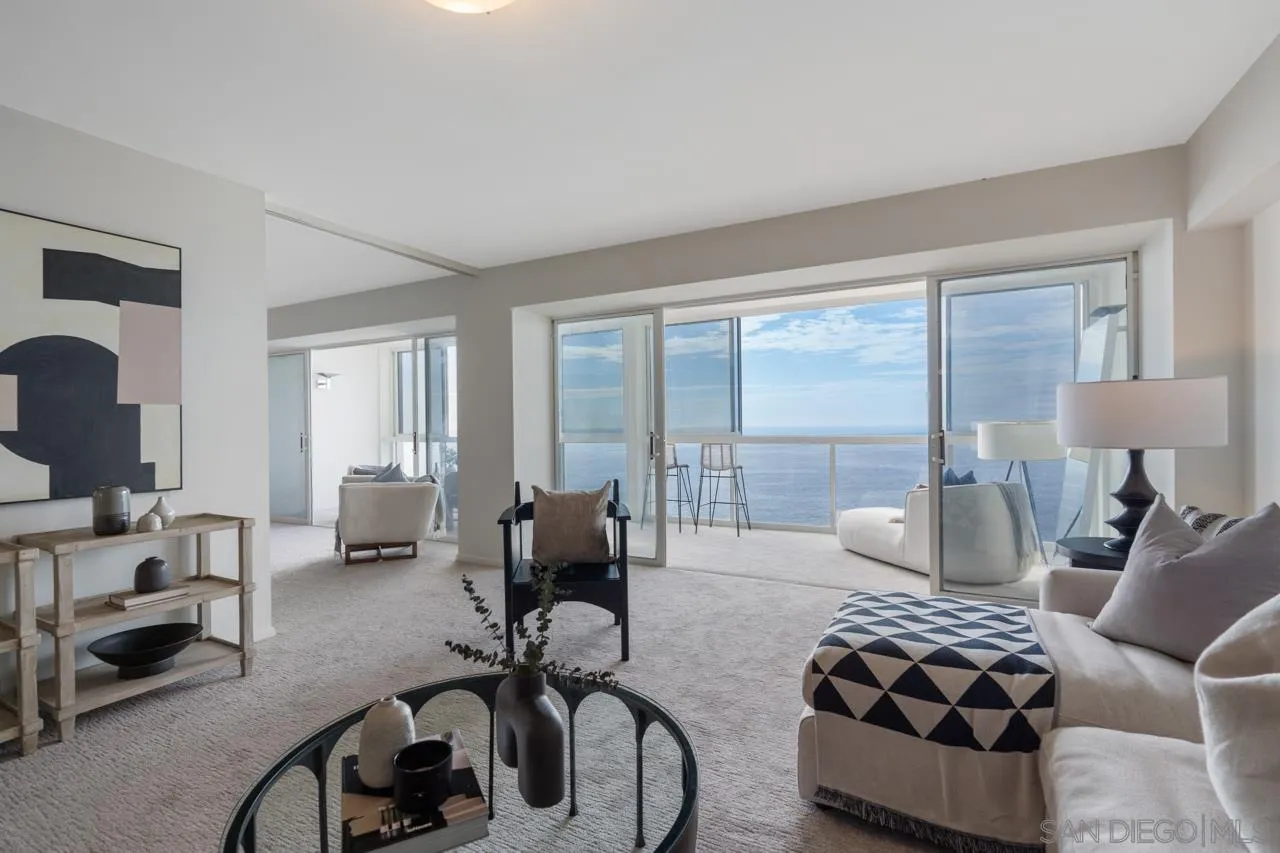 939 Coast Boulevard, Unit 20C La Jolla, CA 92037 - Photo 8 of 25 a bedroom with furniture and a large window