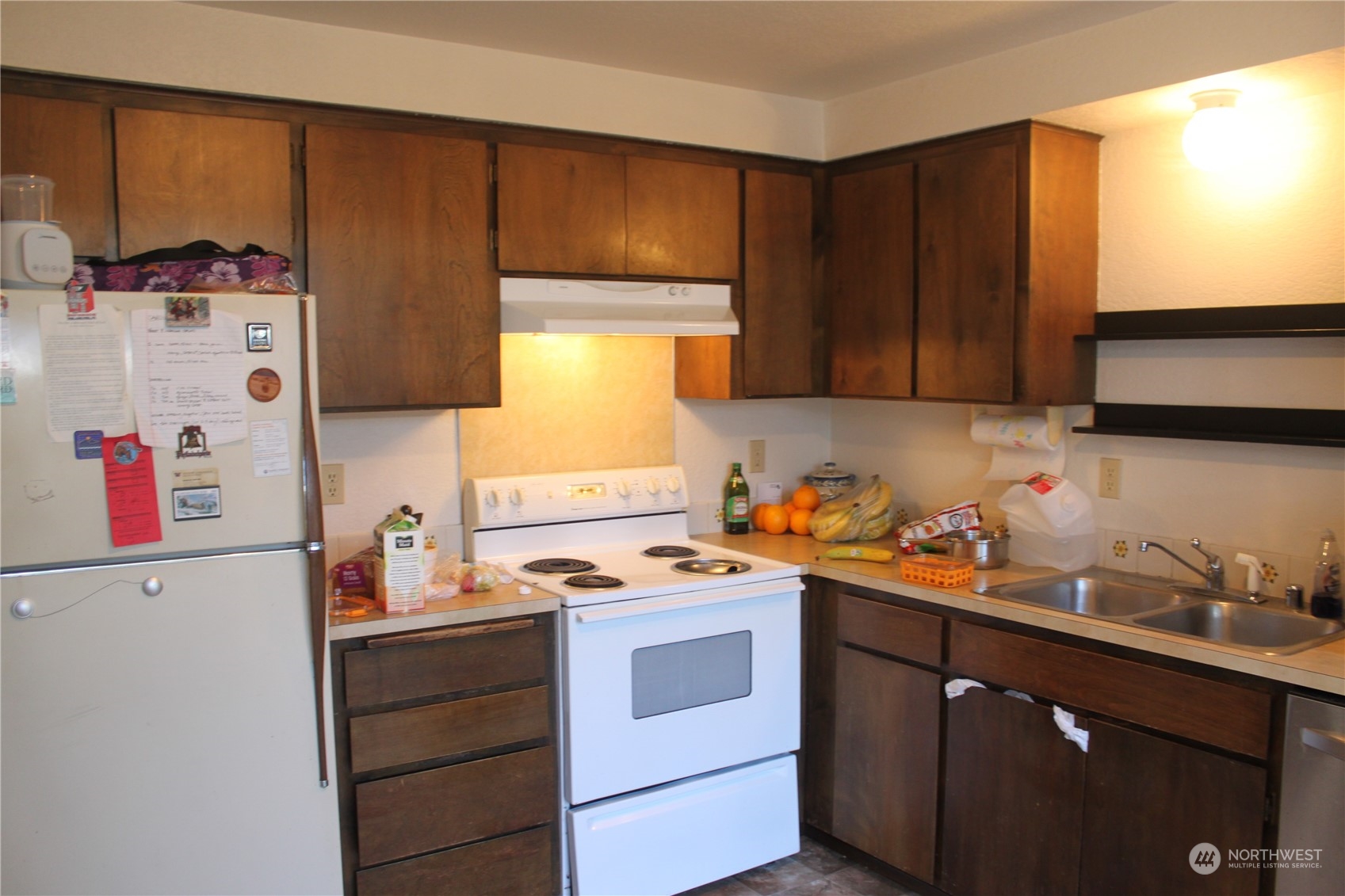 1729 Madison Street Everett, WA 98203 - Photo 11 of 32 a kitchen with a cabinets and white appliances