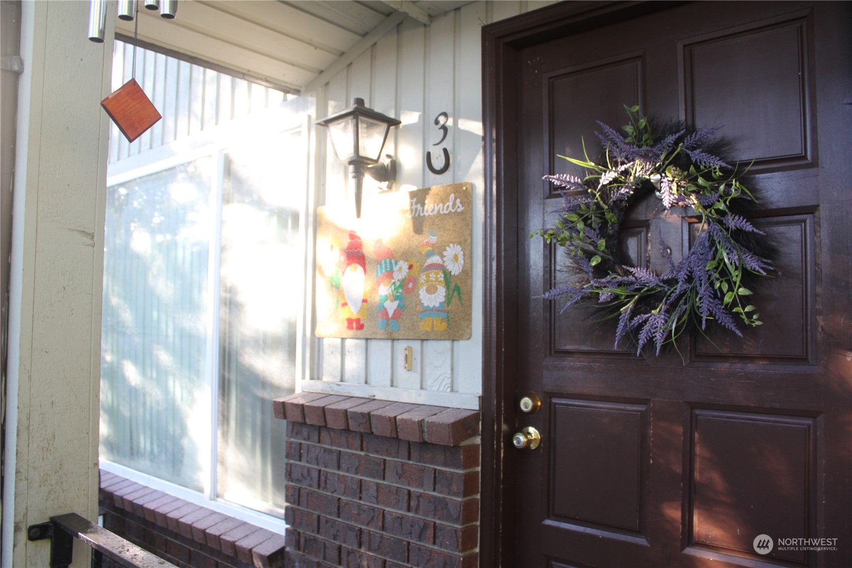 1729 Madison Street Everett, WA 98203 - Photo 7 of 32 a vase of flowers sitting on a table with window